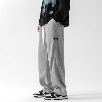 2022 Új divat alkalmi nadrág Ifjúsági vitalitás Klasszikus Uniszex férfi nadrág Egyenes táskás rugalmas deréknadrág fehér szürke fekete 3XL